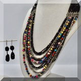 J134. Multi-strand beaded necklace with black beaded earrings. - $34 